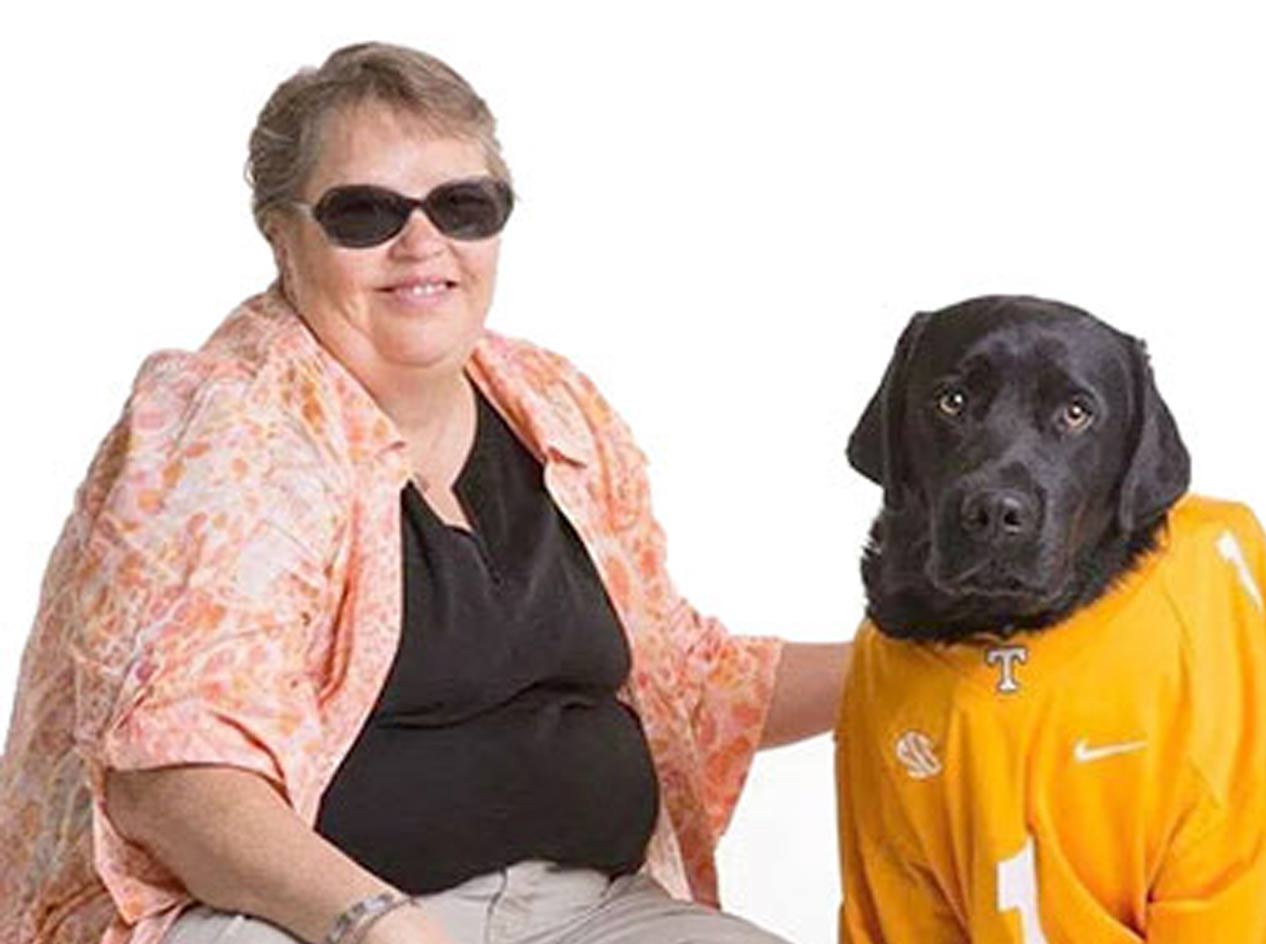 Teresa Mealer with her guide dog Chuck in a sports jersey.