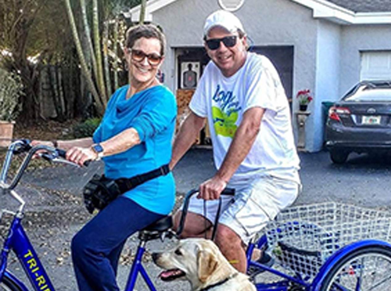 Donna and her husband Jim on a tandem bike.