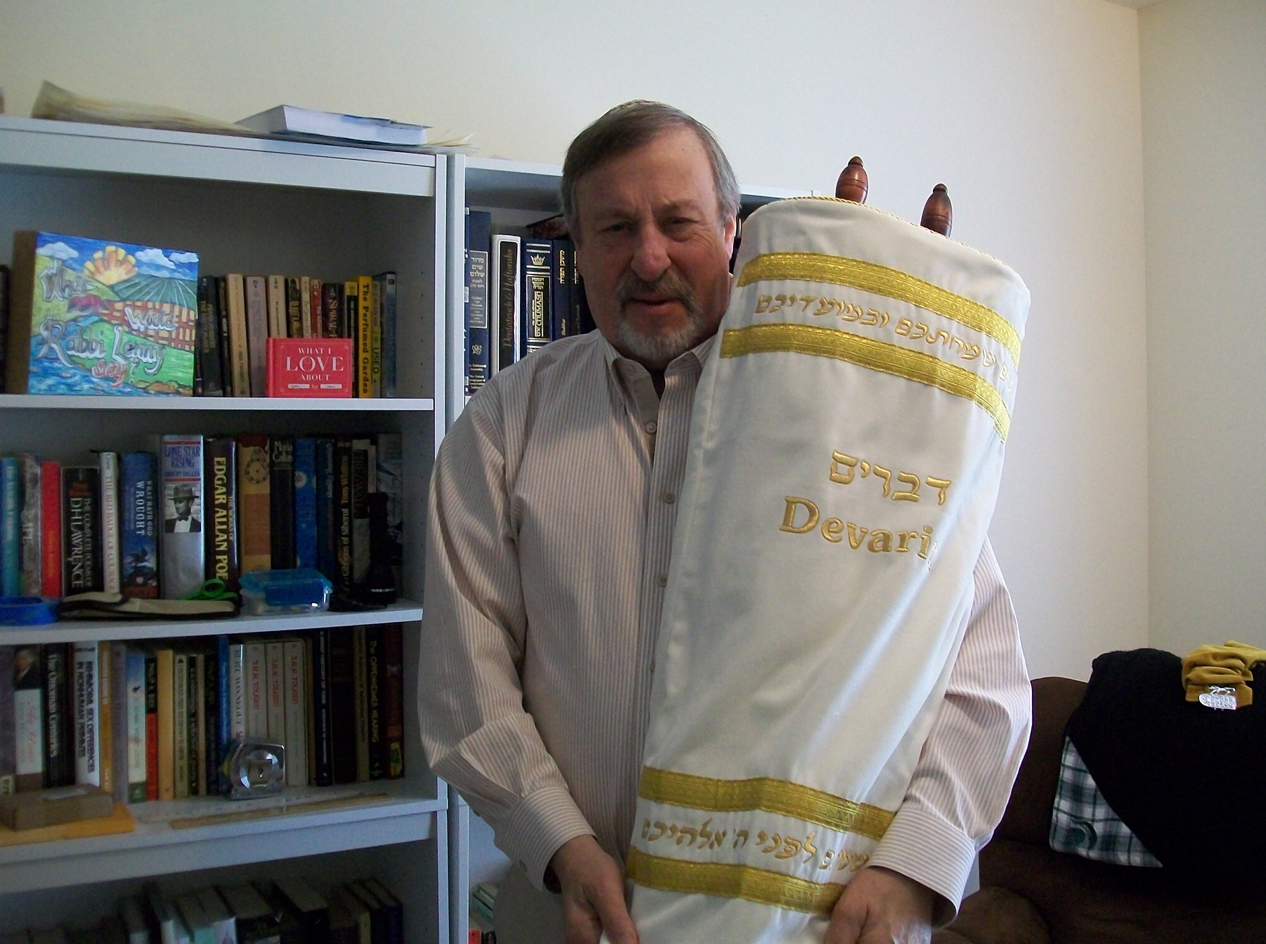 Rabbi Lenny Sarko holding the Braille Torah