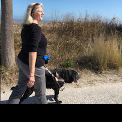 Tara Perry with her guide dog