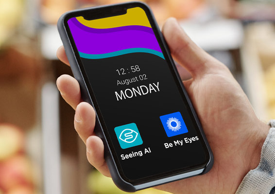 Hand holding cellphone showing the apps Seeing AI and Be My Eyes