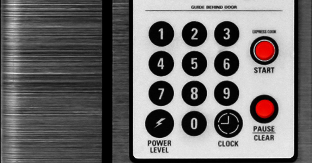 Microwave panel with raised bump dot stickers on Start and Pause buttons