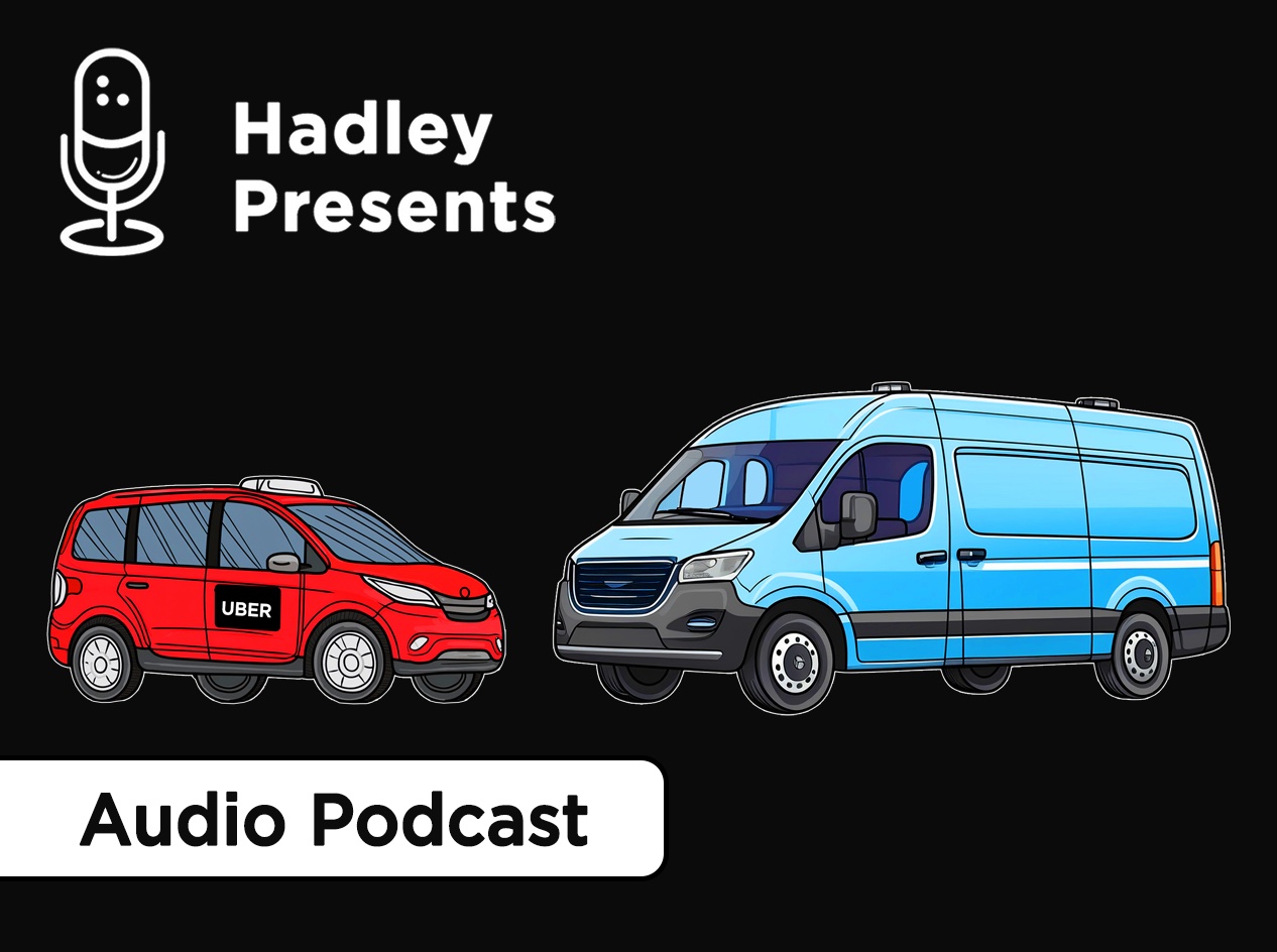 A red uber car and a blue transport van facing each other.