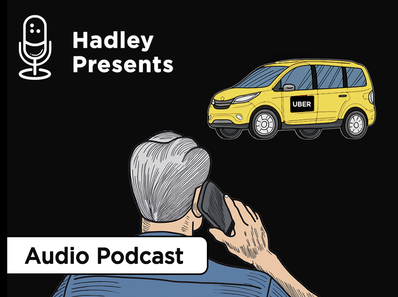 A male adult holding a phone to his right ear and his back to the viewer stands in front of a yellow car with the word "Uber".