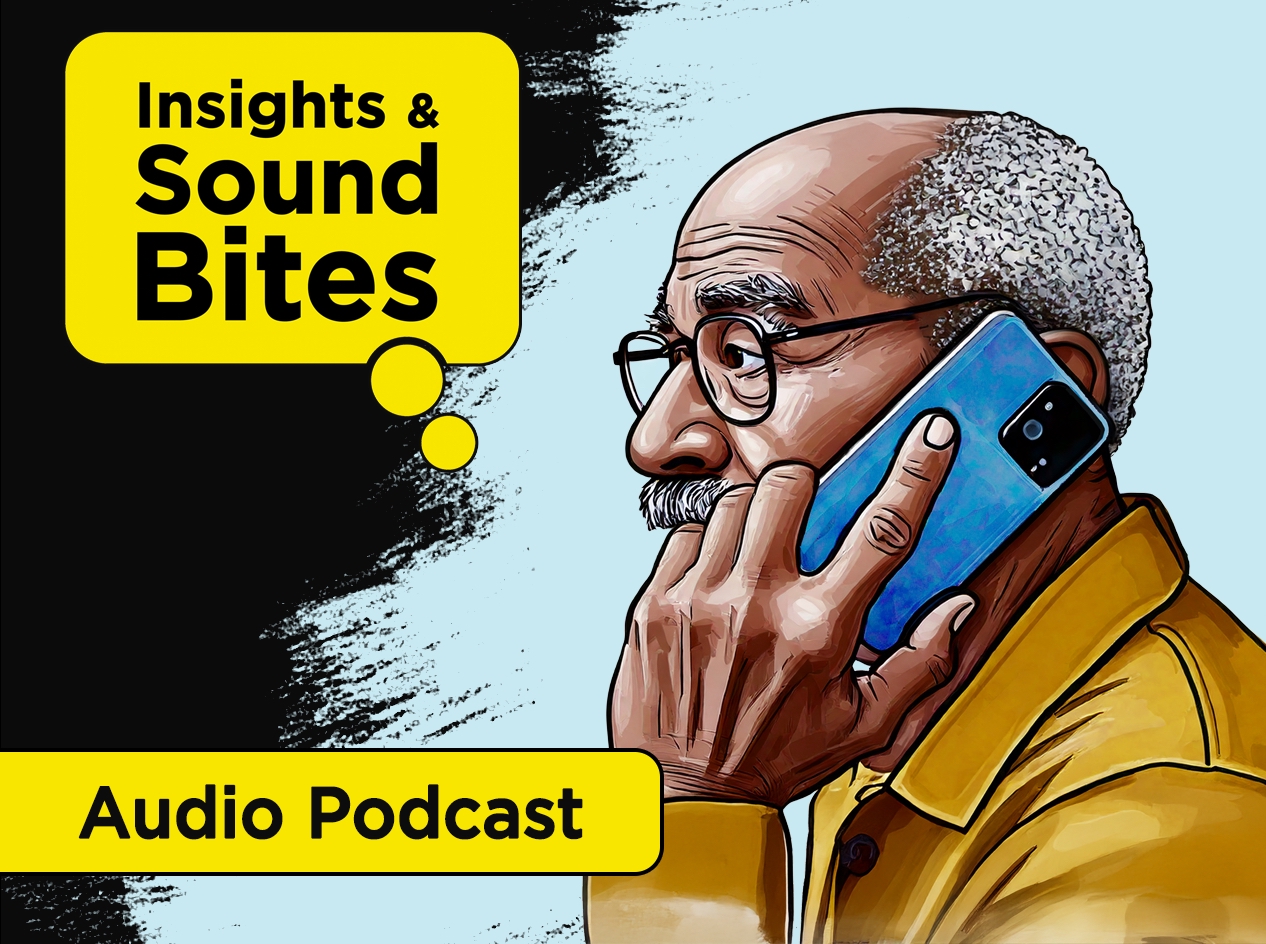 Older African American man talking on smartphone held next to his left ear.
