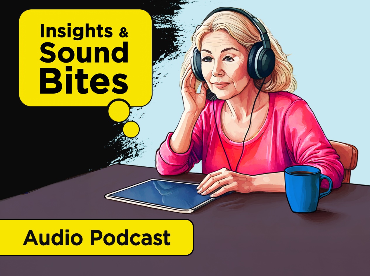 Woman wearing headphones connected to iPad that is on the table in front of her.