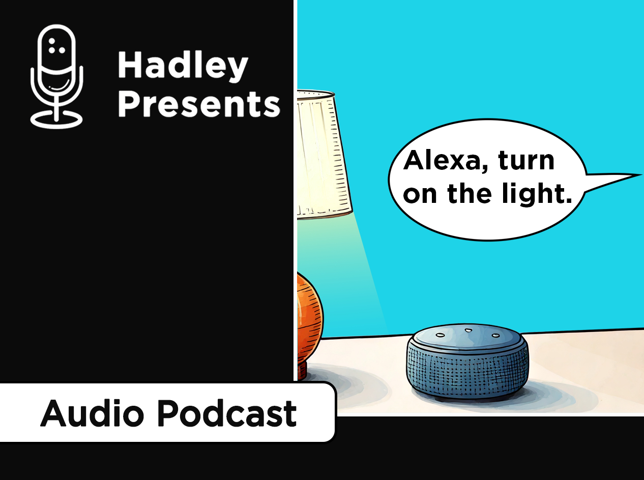 Amazon echo dot on a desk next to a table lamp. A talk bubble with the text, "Alexa, turn on the light," points off to the right.