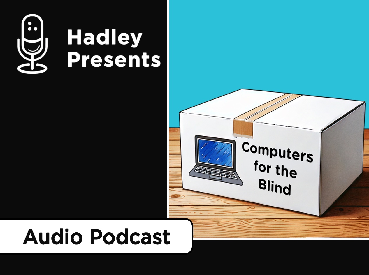 A white shipping box with front side showing an open laptop icon next to "Computers for the Blind" in large black text. Box is placed on a wooden tabletop.