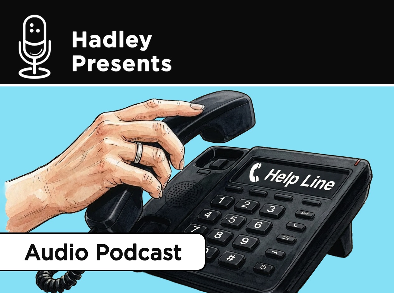 Older woman's right hand picking up the receiver on a black business-style phone labeled "Help Line" above the buttons.