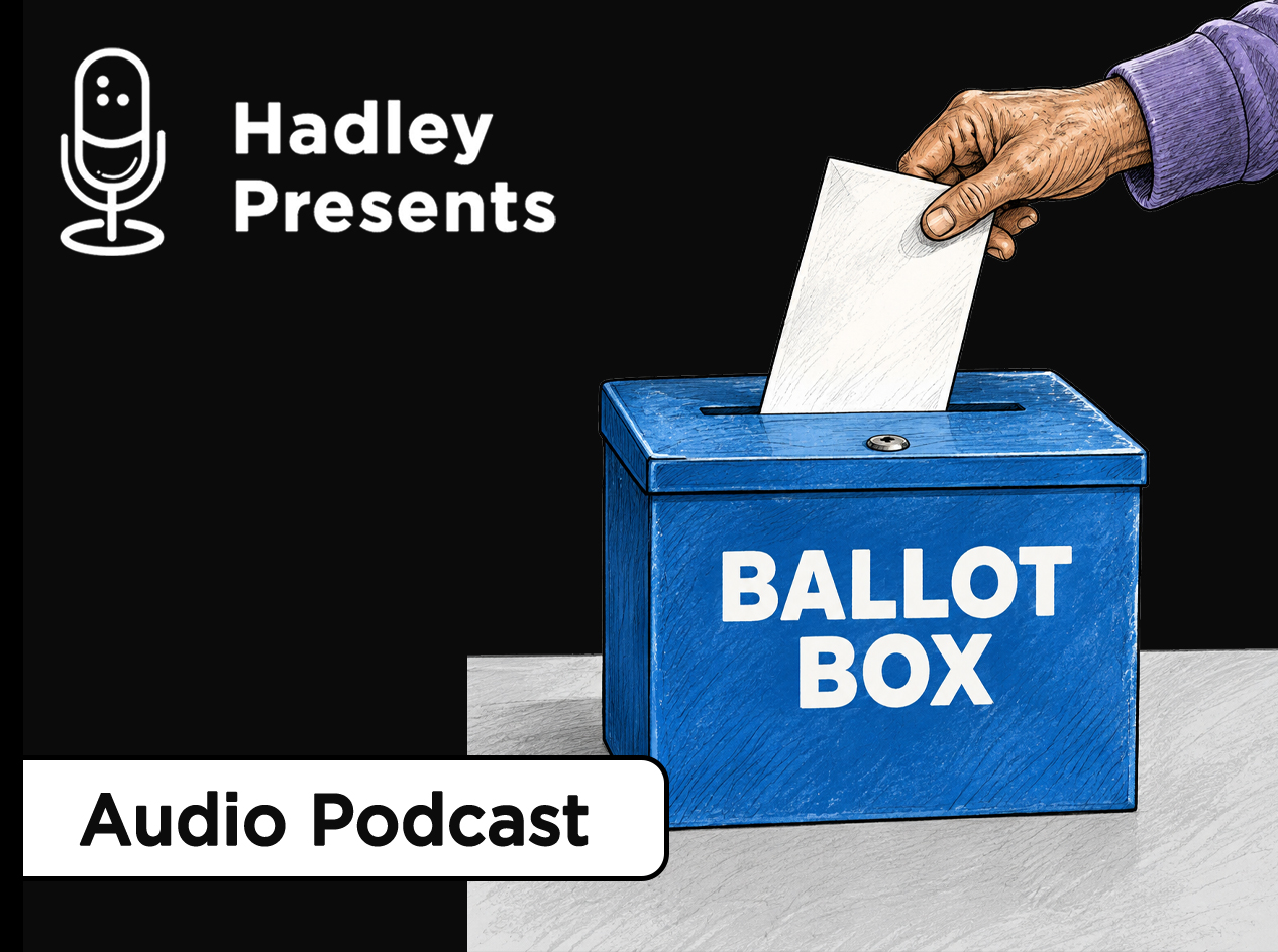 Close-up of an older man's hand slipping a ballot into the slot of a locked, blue ballot box.